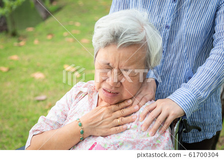 Asian senior mother have nerve pain,shoulder and neck pains,female caregiver or daughter massaging her shoulders elderly woman,feeling very painful,muscle soreness,inflammation,shoulder ache,health ca Asian senior mother have nerve pain,shoulder and neck pains,female caregiver or daughter massaging her shoulders elderly woman,feeling very painful,muscle soreness,inflammation,shoulder ache,health ca 61700304