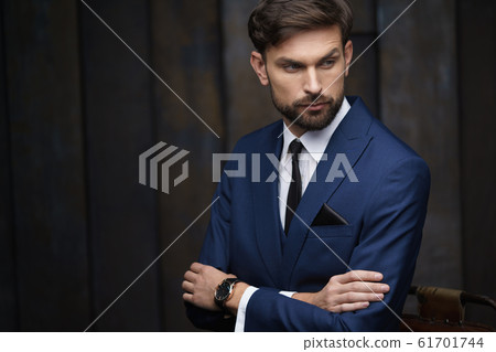 indoor photo of young handsome stylish businessman wearing suit 61701744