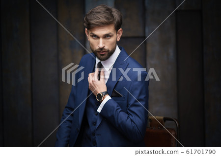 indoor photo of young handsome stylish businessman wearing suit 61701790