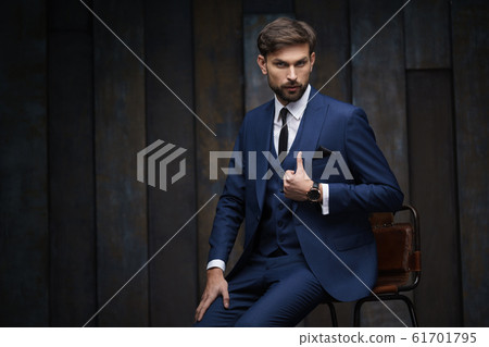 indoor photo of young handsome stylish businessman wearing suit 61701795