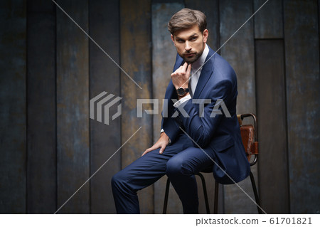 indoor photo of young handsome stylish businessman wearing suit 61701821