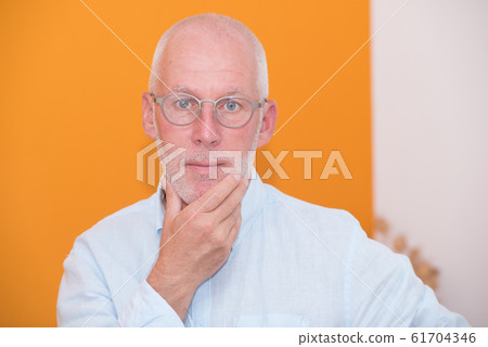 mature senior man with blue shirt 61704346