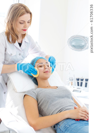 A woman, a professional doctor, a beautician 61706336