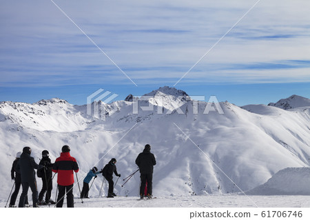 Group of skiers before start on off-piste descent Group of skiers before start on off-piste descent 61706746