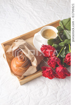 Coffee and muffins on a wooden tray. With a 61706821