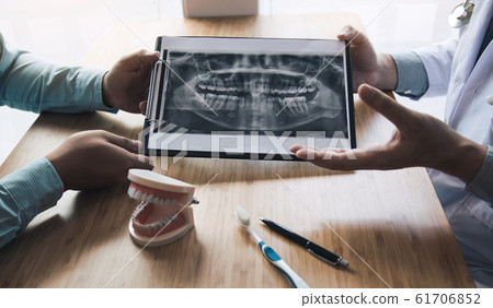 Dentists are discussing dental problems at report Dentists are discussing dental problems at report 61706852