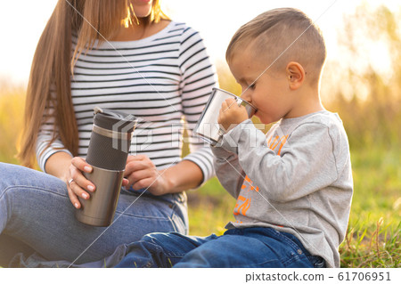 Happy family on autumn walk. Young beautiful 61706951