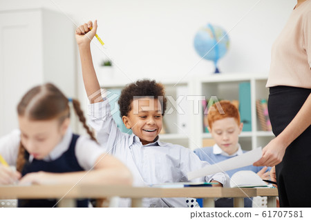 Schoolboy getting a good mark 61707581