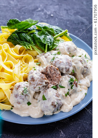 classic Swedish meatballs served with egg noodle classic Swedish meatballs served with egg noodle 61707956