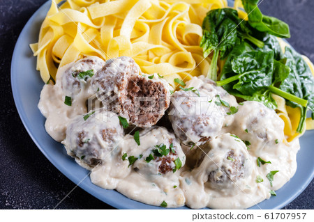 classic Swedish meatballs served with egg noodle classic Swedish meatballs served with egg noodle 61707957