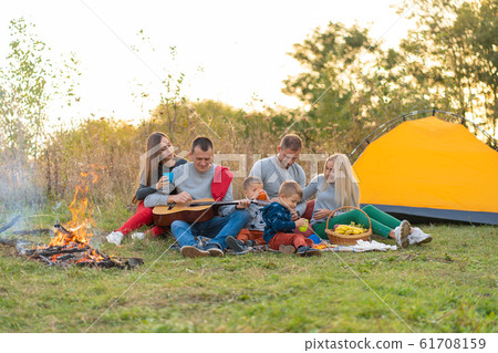 travel, tourism, hike, picnic and people concept - 61708159