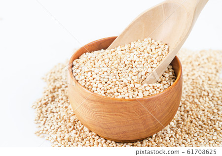 quinoa seeds in wooden spoon. 61708625