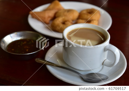 Wada (bean donut) and tofu jaw (chicken fried tofu) condensed milk coffee Myanmar snack taunggyi Wada (bean donut) and tofu jaw (chicken fried tofu) condensed milk coffee Myanmar snack taunggyi 61709517