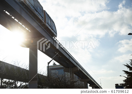 Maglev train running on elevated tracks 61709612