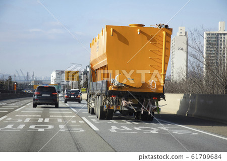 Yellow loading bin on a truck Yellow loading bin on a truck 61709684