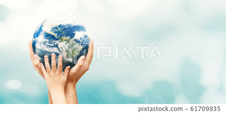 Earth globe in family hands. World environment day Earth globe in family hands. World environment day 61709835