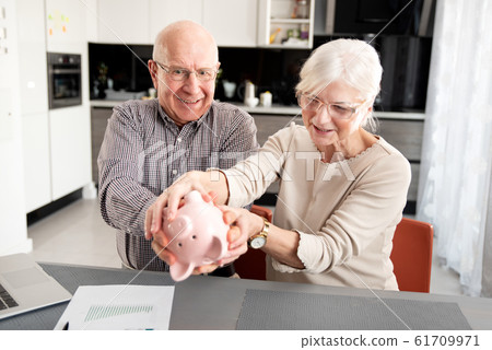 Senior couple is trying to get the savings Senior couple is trying to get the savings 61709971
