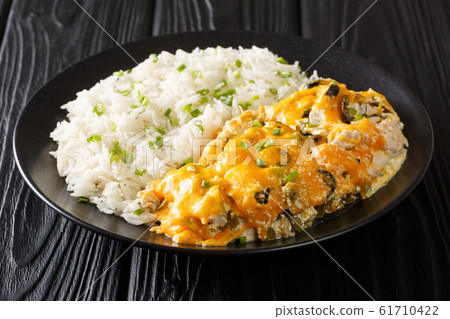 Serving Olivia chicken casserole with olives, Serving Olivia chicken casserole with olives, 61710422