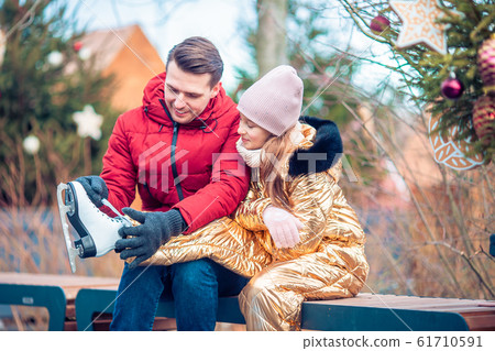Family winter sport. Father and daughter on winter day Family winter sport. Father and daughter on winter day 61710591
