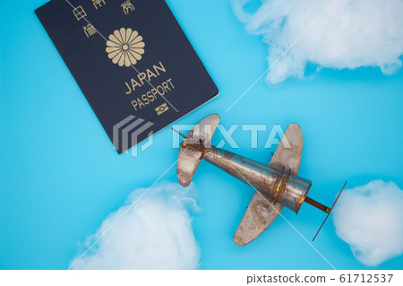 Overseas travel image: airplane, clouds and passport Overseas travel image: airplane, clouds and passport 61712537