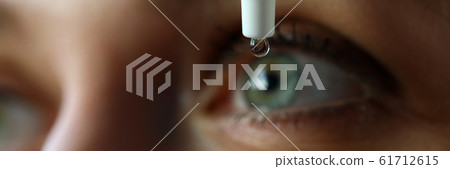 Female putting liquid drops in her eye solving vision problem Female putting liquid drops in her eye solving vision problem 61712615
