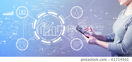Content marketing concept with woman using a tablet 61714501
