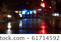 Window glass in rainy day. Bokeh night traffic lights 61714592