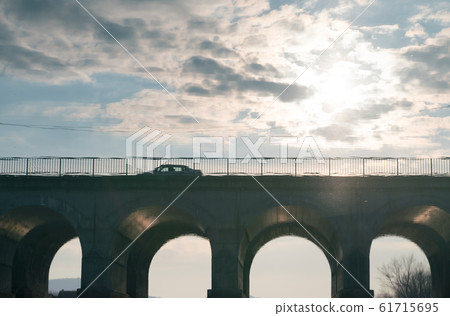 reflection of the bridge on the water surface of the river reflection of the bridge on the water surface of the river 61715695