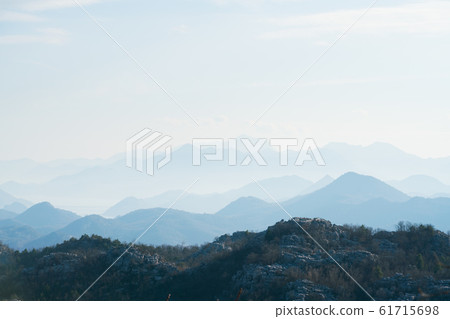 mountains range in the haze in Montenegro 61715698