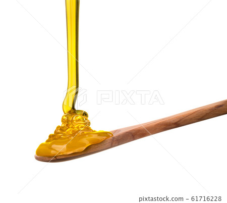 Falling and flowing honey on a wooden spoon isolated on white with clipping path Falling and flowing honey on a wooden spoon isolated on white with clipping path 61716228