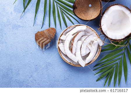 Sliced coconut and palm leaves Sliced coconut and palm leaves 61716817