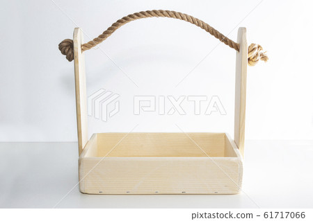 Empty wooden box. Made of pine, on a light white 61717066