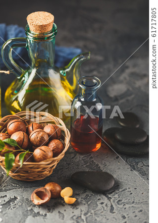 Natural macadamia oil in a glass bottle with 61717805
