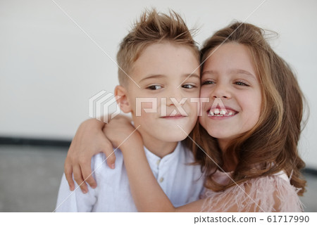 young happy boy and girl together outside 61717990