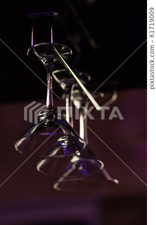 Glasses for a martini hang over a bar counter at Glasses for a martini hang over a bar counter at 61719009