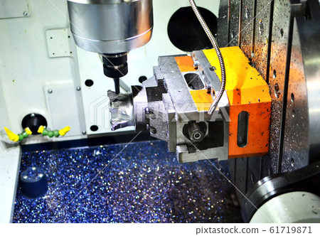 Modern CNC milling machine in the process of drilling a metal cylindrical shaft with internal thread Modern CNC milling machine in the process of drilling a metal cylindrical shaft with internal thread 61719871