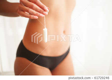 Period. Close Up Of Woman Slim Body In Panties Holding Tampon 61720246