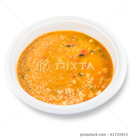 Dish of Caldoso Marinero rice on a white background 61720913