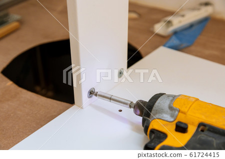 Wooden furniture installing cabinet shelf screws Wooden furniture installing cabinet shelf screws 61724415