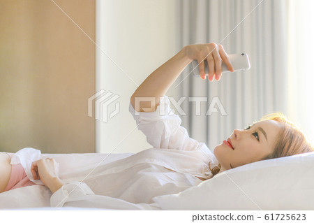 20s woman lifestyle bedroom relaxation 20s woman lifestyle bedroom relaxation 61725623