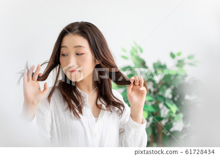 Women suffering from damage hair Women suffering from damage hair 61728434