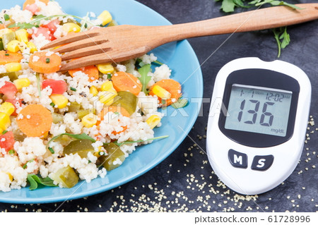 Glucose meter for checking sugar level and salad 61728996