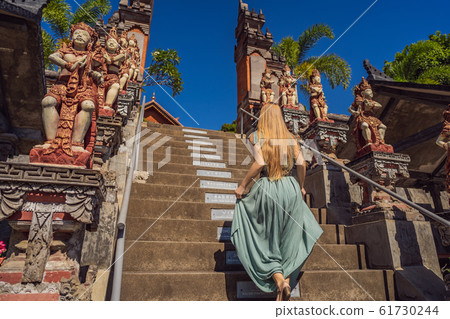 Young woman tourist in budhist temple Brahma Vihara Arama Bali TRANSLATION The abilities of people Young woman tourist in budhist temple Brahma Vihara Arama Bali TRANSLATION The abilities of people 61730244