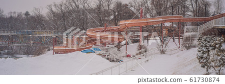 Summer water park in winter under the snow BANNER, LONG FORMAT Summer water park in winter under the snow BANNER, LONG FORMAT 61730874