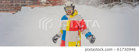 A man throws snow and enjoys the winter, outside BANNER, LONG FORMAT 61730946