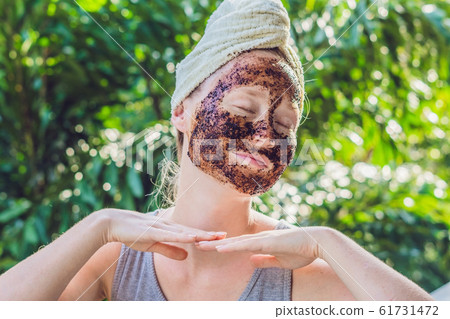 Face Skin Scrub. Portrait Of Sexy Smiling Female Model Applying Natural Coffee Mask, Face Scrub On Facial Skin. Closeup Of Beautiful Happy Woman With Face Covered With Beauty Product. High Resolution Face Skin Scrub. Portrait Of Sexy Smiling Female Model Applying Natural Coffee Mask, Face Scrub On Facial Skin. Closeup Of Beautiful Happy Woman With Face Covered With Beauty Product. High Resolution 61731472