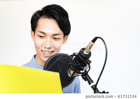 Young men (white background, voice actor, microphone, recording, condenser microphone Young men (white background, voice actor, microphone, recording, condenser microphone 61731534