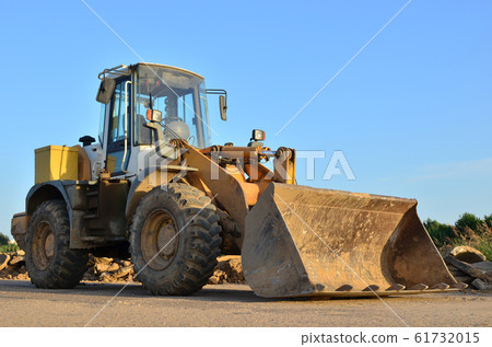 Front-end loader working on construction site 61732015
