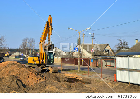 Excavator at a construction site during earthworks Excavator at a construction site during earthworks 61732016