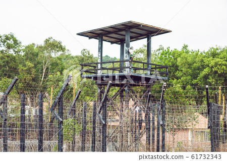 Watch tower at the Prison in the tropics. In the tower is the caretaker's dummy Watch tower at the Prison in the tropics. In the tower is the caretaker's dummy 61732343